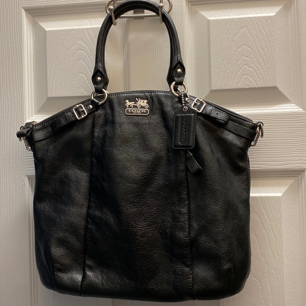 Leather Coach: Black leather shoulder bag, purple silky lining inside.